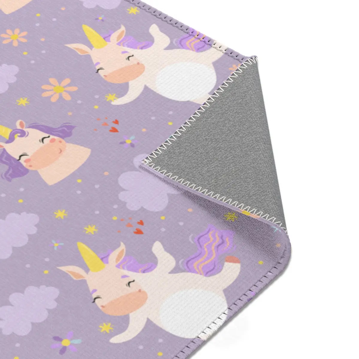 Kinderteppich "Einhornkür" von spielzwerg. Nahaufnahme umgeklappte Ecke. RUG-00111-XL, RUG-00111-L.