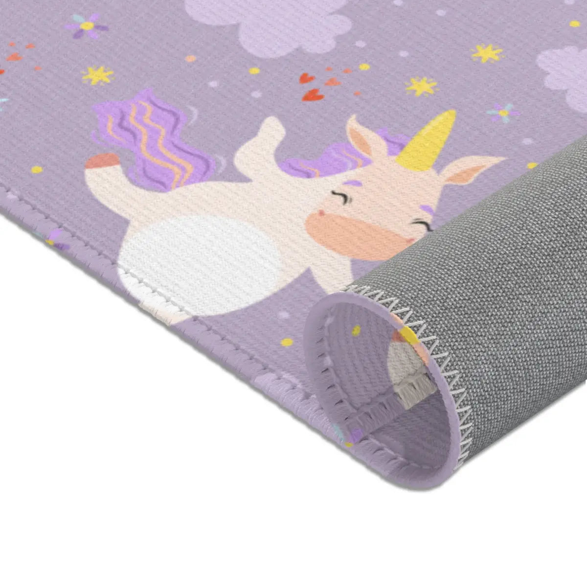 Kinderteppich "Einhornkür" von spielzwerg. Nahaufnahme gerollt. RUG-00111-XL, RUG-00111-L.