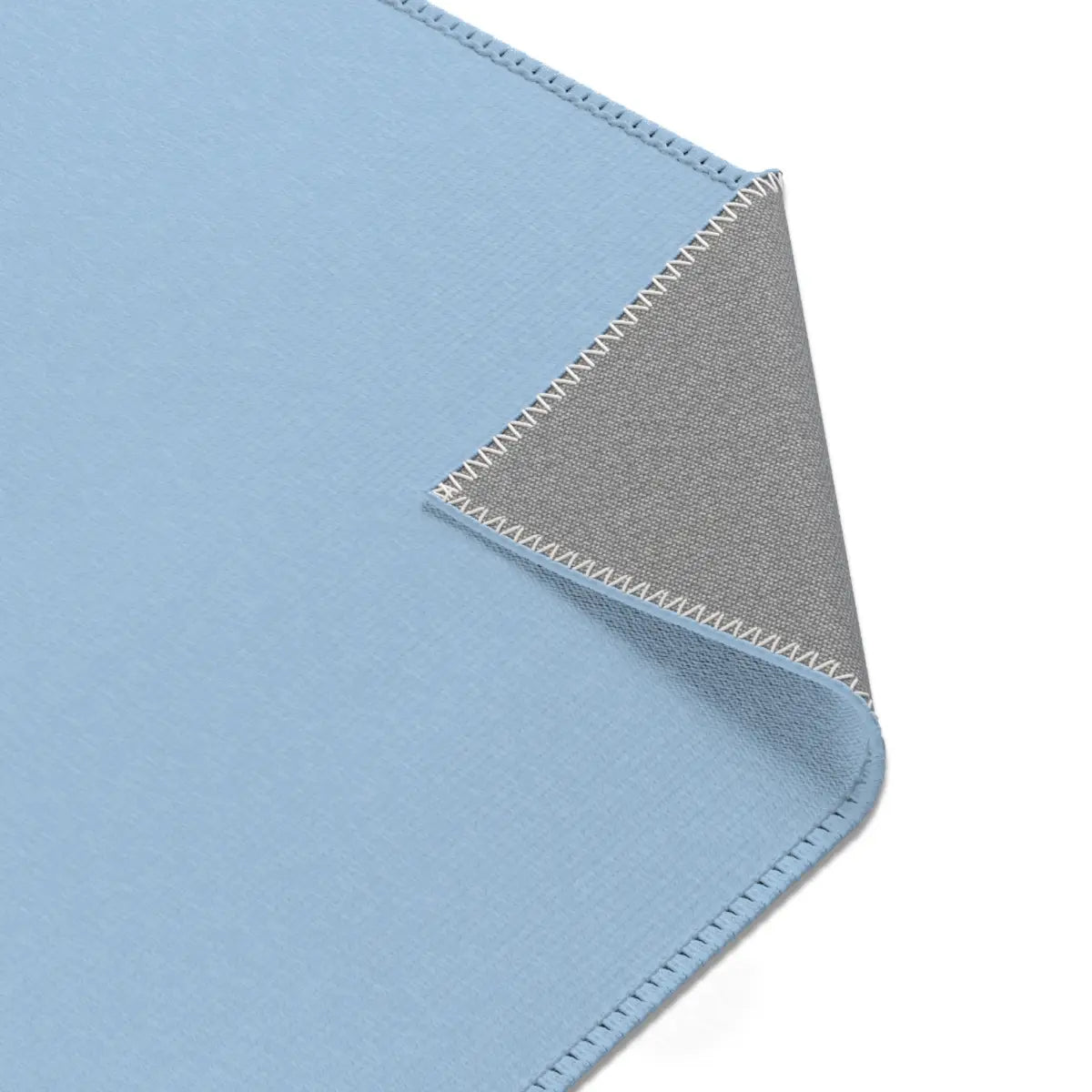 Kinderteppich "Blauwal" von spielzwerg. Nahaufnahme umgeklappte Ecke. RUG-00206-XL, RUG-00206-L.