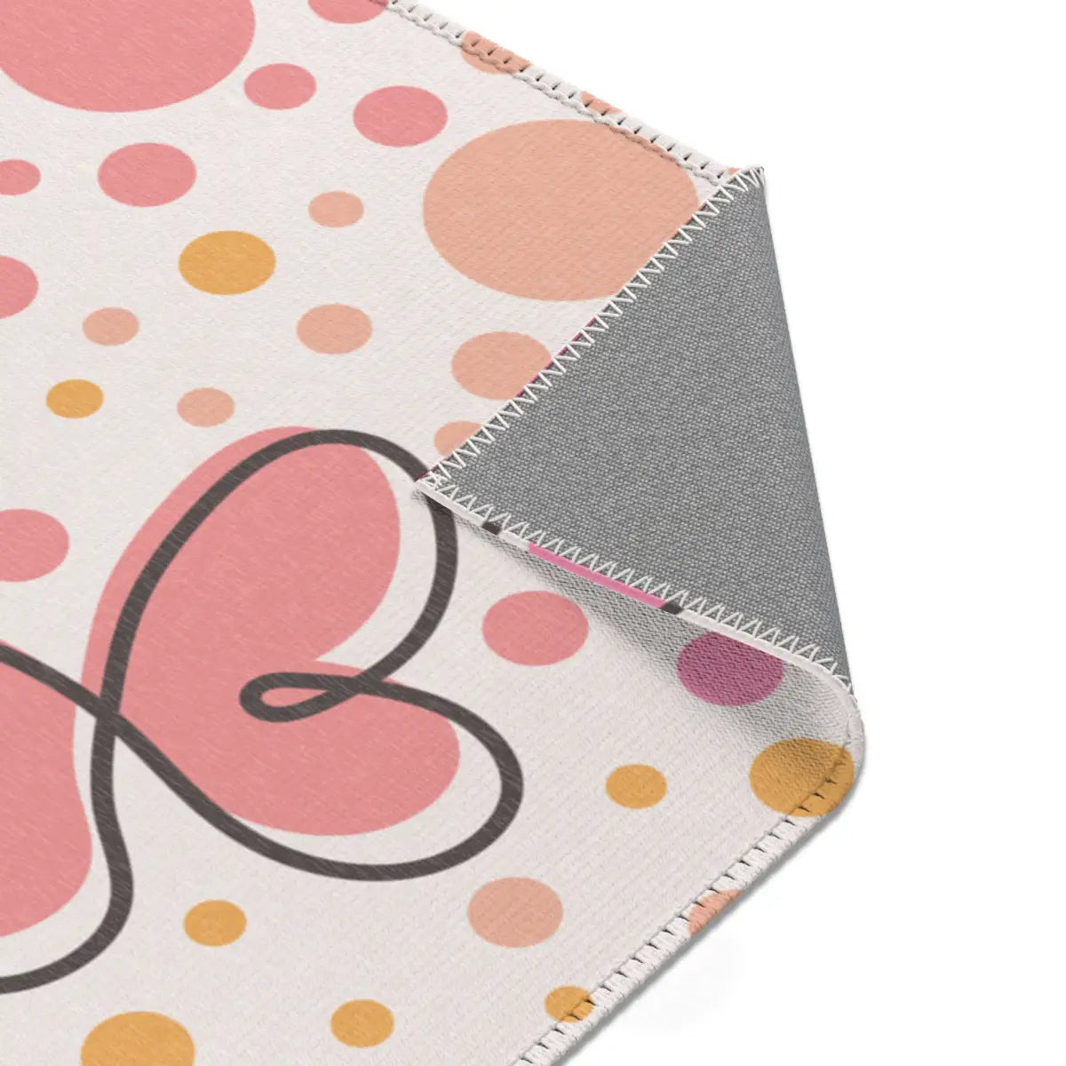 Kinderteppich "Schmetterlinge mit Punkten" von spielzwerg. Nahaufnahme umgeklappte Ecke. RUG-00063-XL, RUG-00063-L.