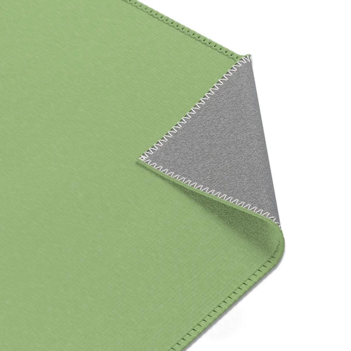Kinderteppich "Kroko" von spielzwerg. Nahaufnahme umgeklappte Ecke. RUG-00202-XL, RUG-00202-L.