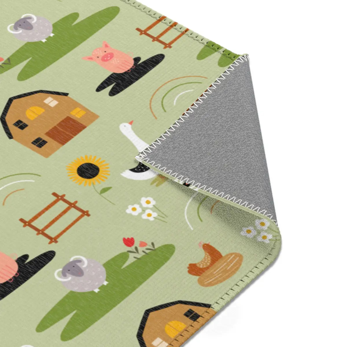 Kinderteppich "Auf der Weide" von spielzwerg. Nahaufnahme umgeklappte Ecke. RUG-00005-XL, RUG-00005-L.