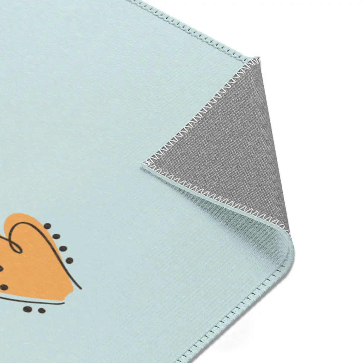 Kinderteppich "Ari" von spielzwerg. Nahaufnahme umgeklappte Ecke. RUG-00056-XL, RUG-00056-L.
