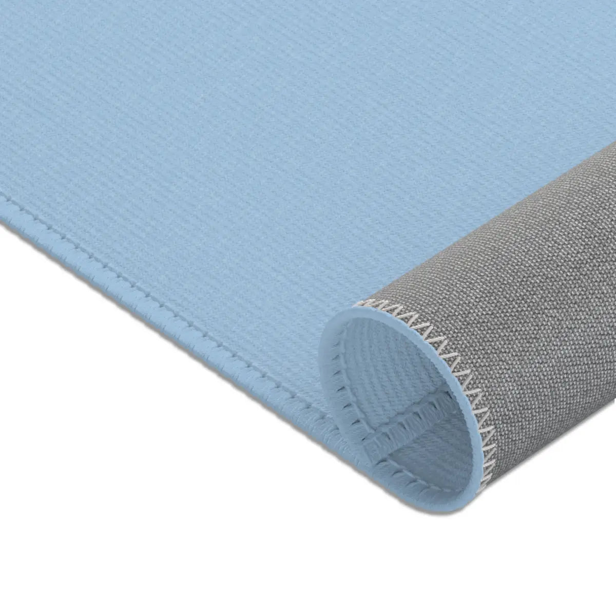 Kinderteppich "Blauwal" von spielzwerg. Nahaufnahme gerollt. RUG-00206-XL, RUG-00206-L.