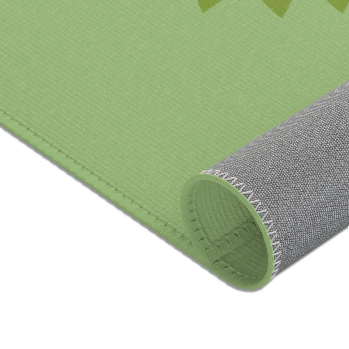 Kinderteppich "Kroko" von spielzwerg. Nahaufnahme gerollt. RUG-00202-XL, RUG-00202-L.