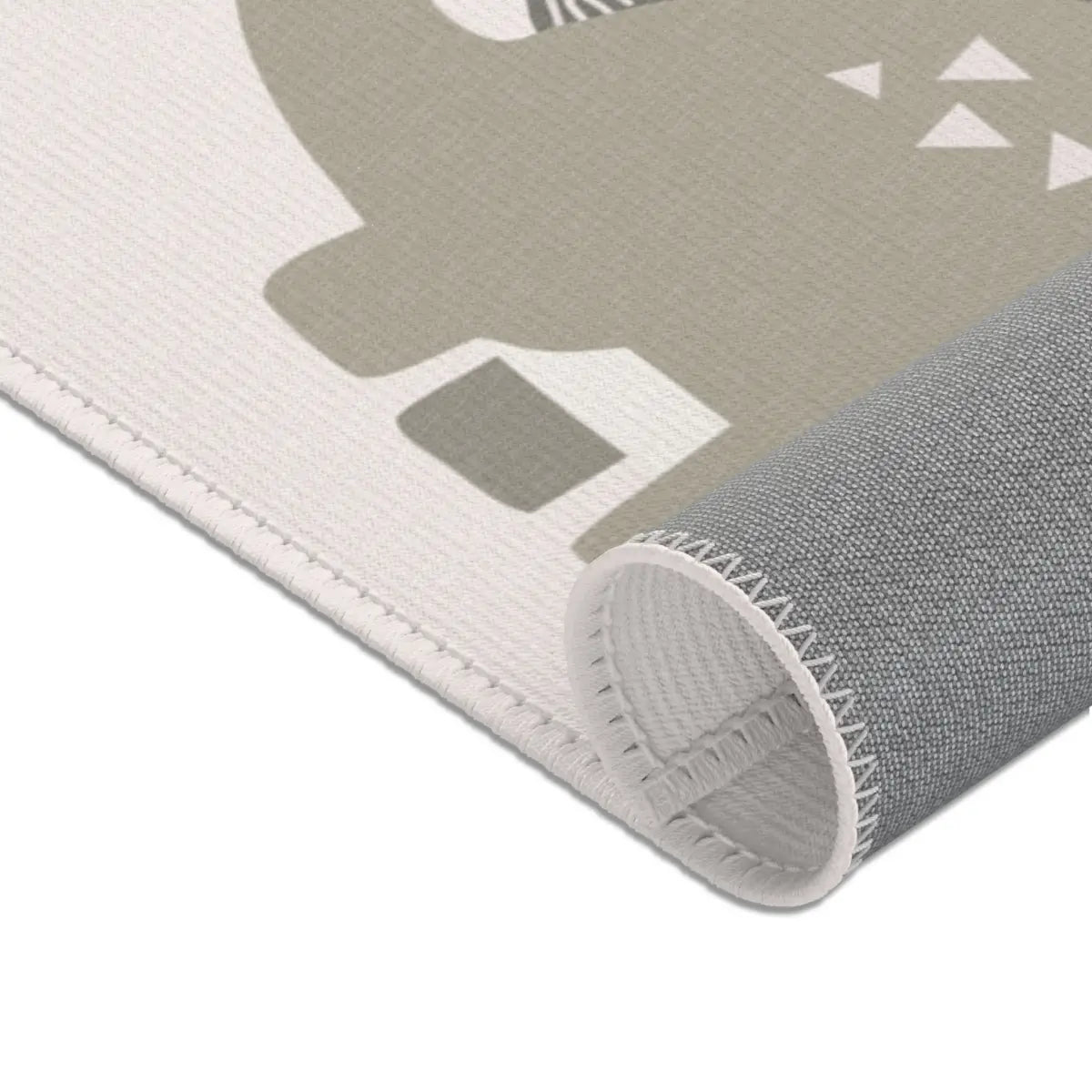 Kinderteppich "Niedliche Dinos" von spielzwerg. Nahaufnahme gerollt. RUG-00081-XL, RUG-00081-L.