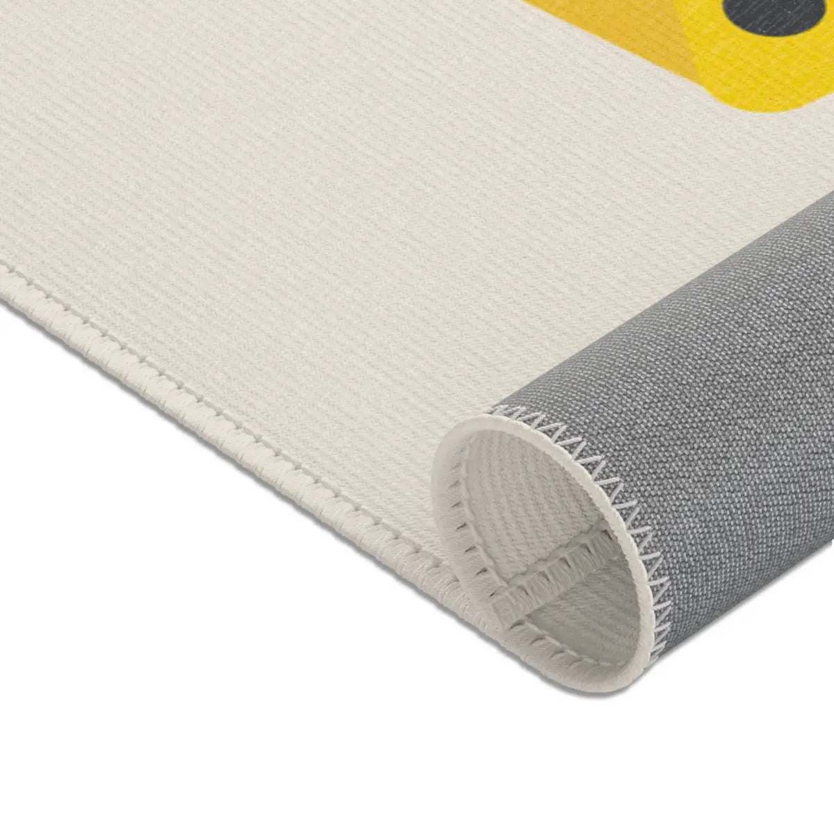 Kinderteppich "Großer Bagger" von spielzwerg. Nahaufnahme gerollt. RUG-00200-XL, RUG-00200-L.